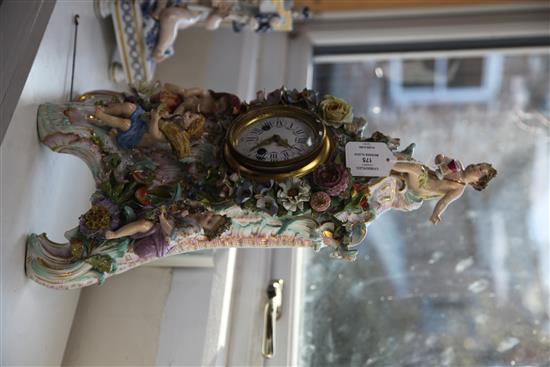 A large Meissen figural mantel clock, late 19th century, height 48cm, slight losses to flowers